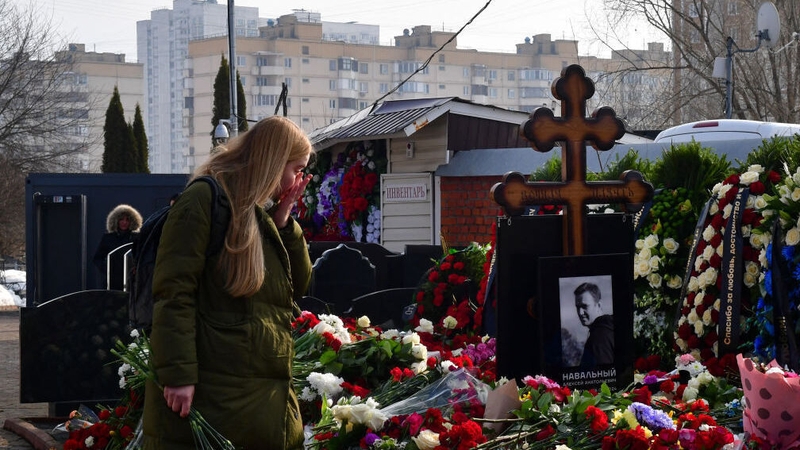 A mourner visits the grave of Russian opposition leader Alexei Navalny at the Borisovo cemetery in Moscow
