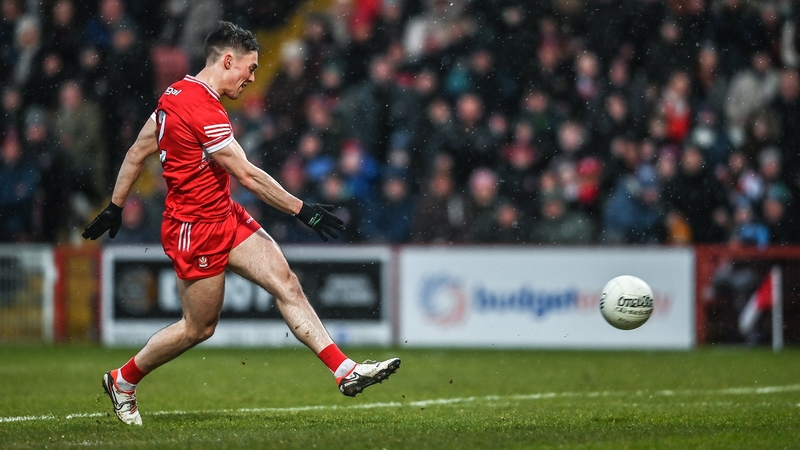 Conor McCluskey shoots to score Derry's first-half goal against Dublin