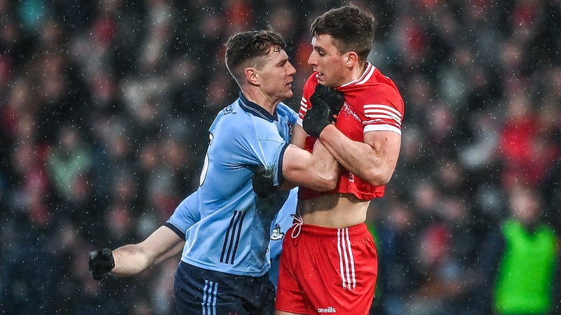 Dublin defender John Small and Derry full-forward Shane McGuigan exchange views at Celtic Park