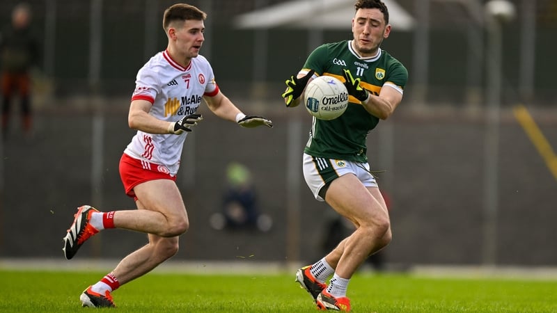 Kerry's Paudie Clifford is chased by Niall Devlin of Tyrone