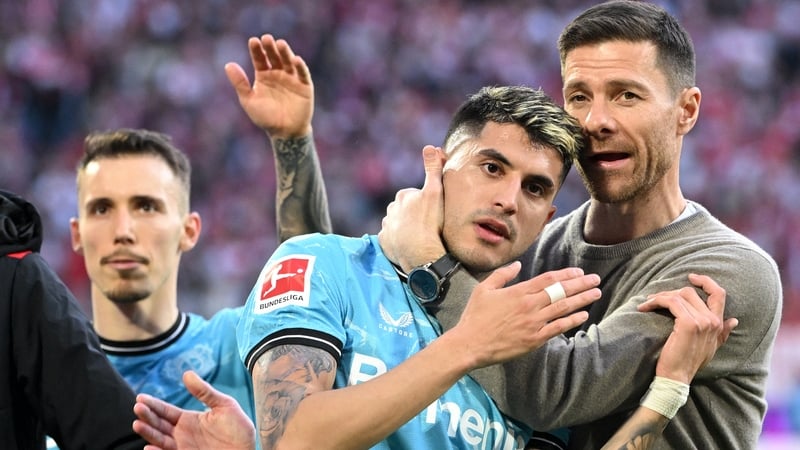 Leverkusen boss Xabi Alonso celebrates with Exequiel Palacios after a 2-0 win over Cologne