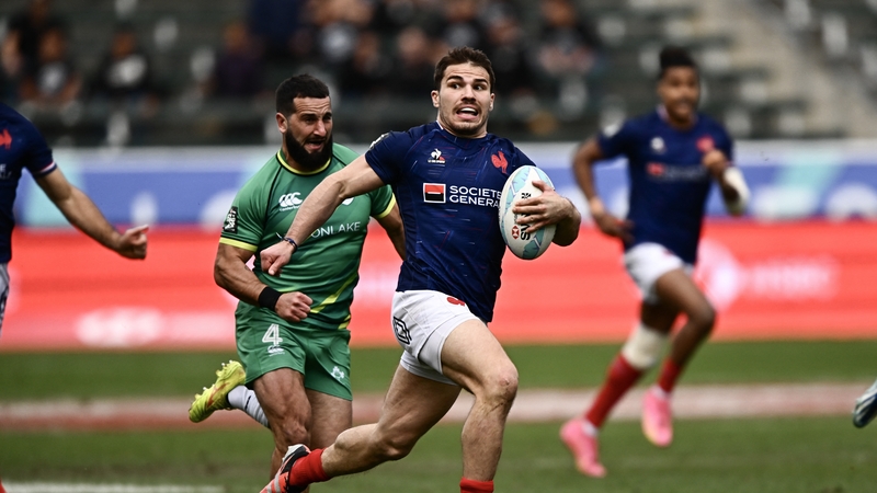 Antoine Dupont runs in his side's first try against Ireland