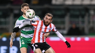 Paul McMullan of Derry City holds off Lee Grace