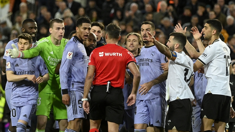 Spanish referee Jesus Gil Manzano is surrounded by Real Madrid players
