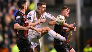 Shelbourne's John Martin battles with Cian Byrne (R) and Jordan Flores of Bohemians
