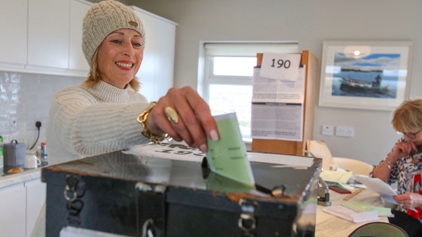 Maria McSweeney casts her ballot inside the polling station set up in the living room of an islander, one of the 28 registered to vote, on Oileán Ghabhla, off Donegal