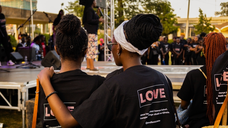 Women stand side-by-side at the University of Nairobi to remember those who have been murdered