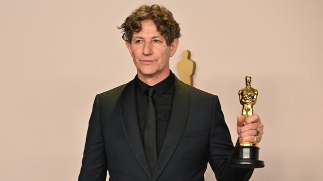 Jonathan Glazer poses in the press room with the Oscar for Best International Feature Film for The Zone of Interest