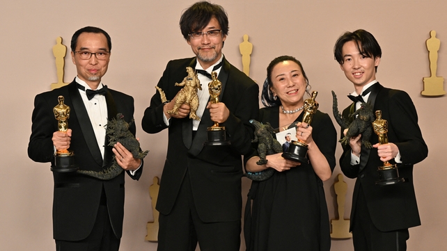 Masaki Takahashi, Takashi Yamazaki, Kiyoko Shibuya and Tatsuji Nojima pose in the press room with the Oscar for Best Visual Effects for Godzilla Minus One