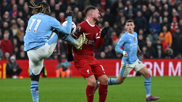 Jeremy Doku's chest high challenge on Alexis MacAllister while attempting to clear the ball