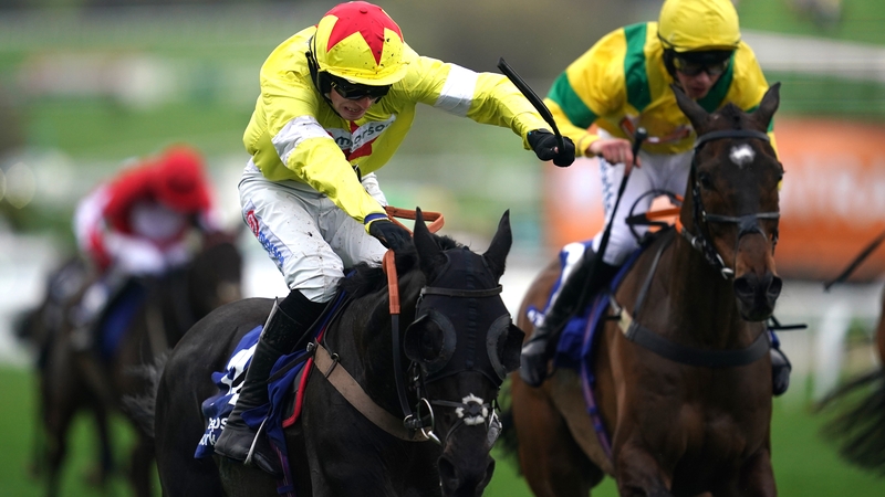 Monmiral with Harry Cobden up (L) produced a big finish to win the Pertemps