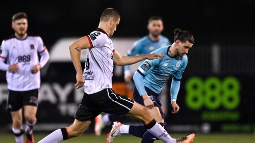 Connor Parsons of Waterford (r) in action against Zak Johnson