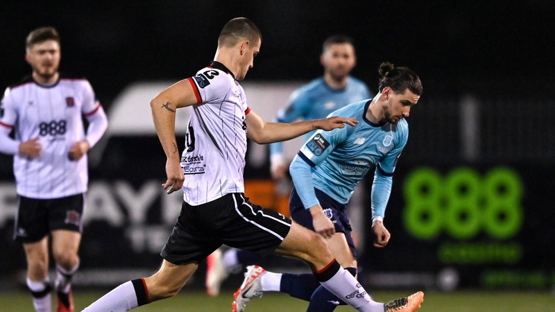 Connor Parsons of Waterford (r) in action against Zak Johnson