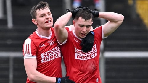 Eoghan McSweeney (L) and Luke Fahy celebrate Cork's win