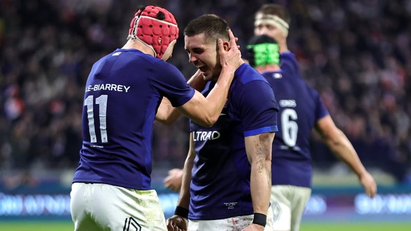 Thomas Ramos of France celebrates with team-mate Louis Bielle-Biarrey at the full-time whistle