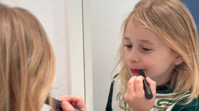 Khloe puts the finishing touches to her St Patrick's Day outfit as she celebrates in Laredo, Spain (Photo: Kate Reville)