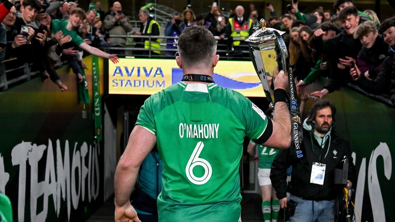 O'Mahony holds the Six Nations trophy as he leaves the pitch