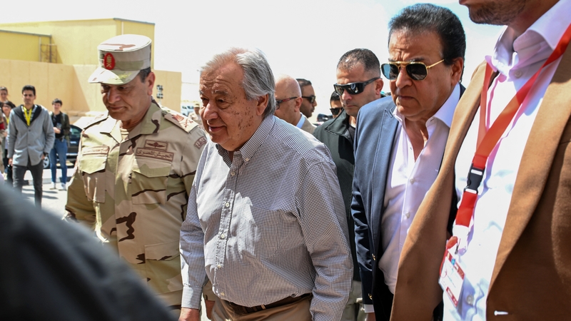 UN Secretary-General Antonio Guterres walks with Egyptian Army Chief Mohammad Abdel Rahman near the Egyptian border with Gaza
