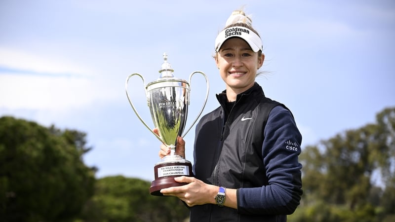 Nelly Korda celebrates with the trophy, her second of the season and 10th overall