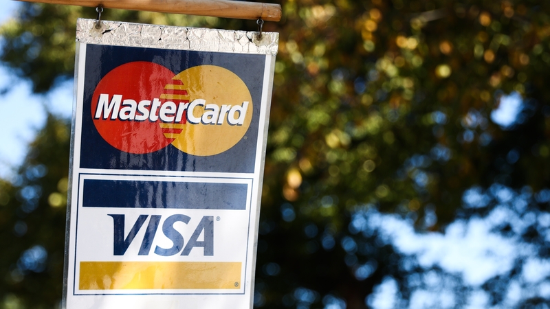 Visa and Mastercard have reached an estimated $30 billion settlement to limit credit and debit card fees for merchants
