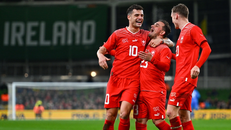 Granit Xhaka embraces Switzerland's goalscorer Xherdan Shaqiri