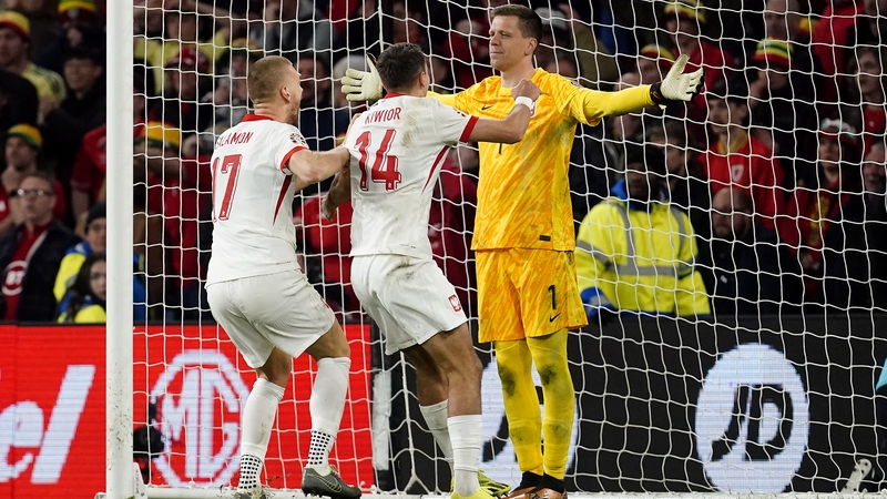 Wojciech Szczesny receives the acclaim of his team-mates at Cardiff City Stadium