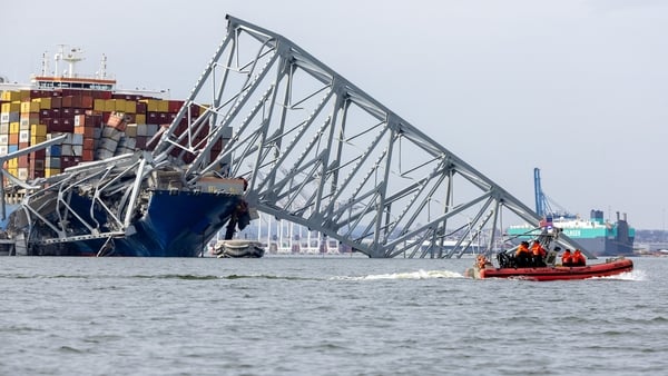 Four more workers who were part of a crew filling potholes on the bridge's road surface remain missing and presumed dead