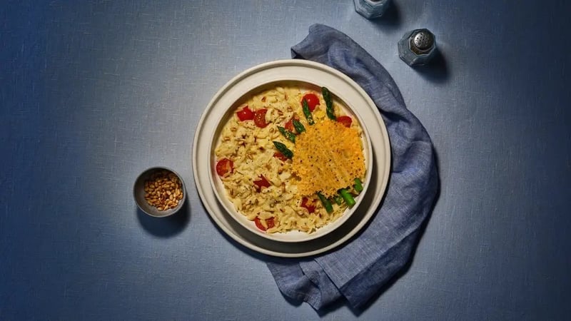 Bluey-inspired cheesy asparagus with tomato orzo (Gousto/PA)