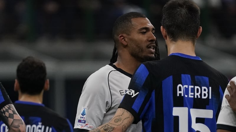 Juan Jesus (L) confronts Francesco Acerbi
