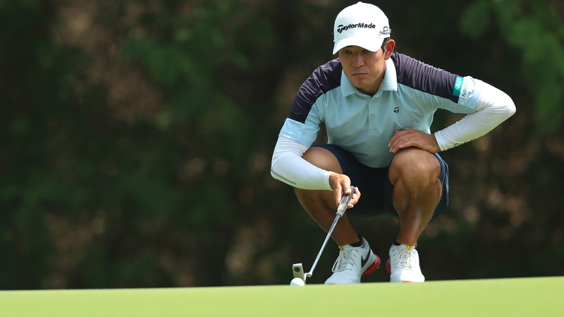Keita Nakajima lines up a putt on the 14th green