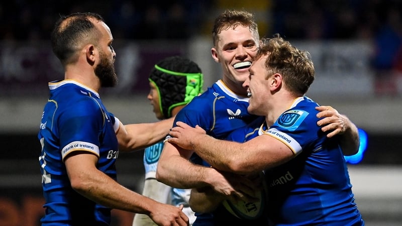 Liam Turner (right) celebrates Leinster's seventh and final try