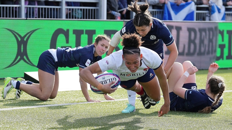 France's wing Kelly Arbey scores a try for the visitors