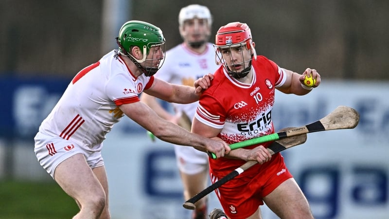 John Mullan of Derry holds off Aidan Kelly of Tyrone during the Allianz Hurling League Division 2B final