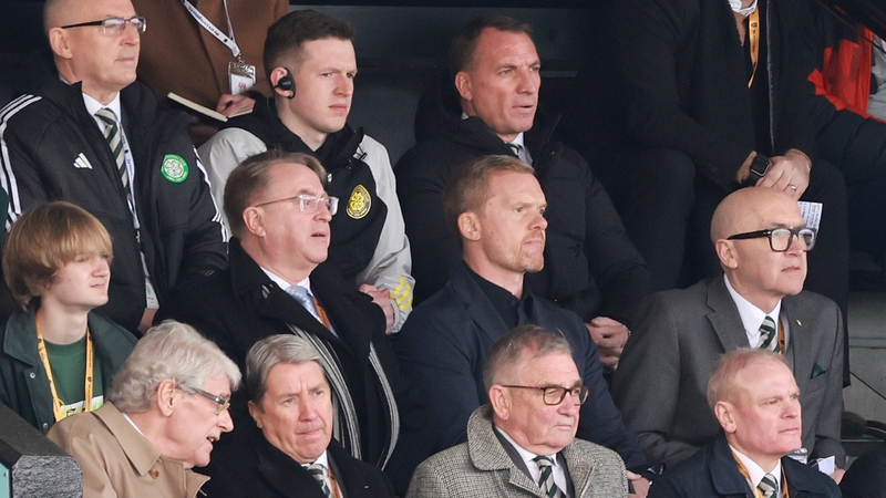 Suspended Celtic manager Brendan Rodgers (top-right) watches the match from the stands