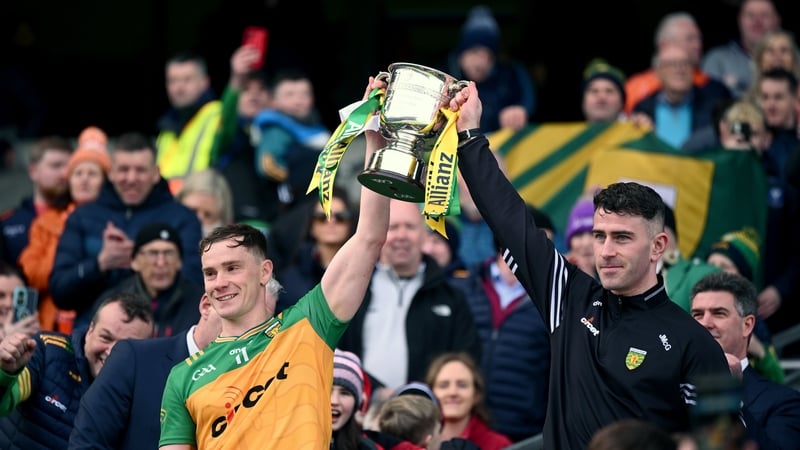 Ciarán Thompson, left, and Patrick McBrearty lift the Division 2 trophy