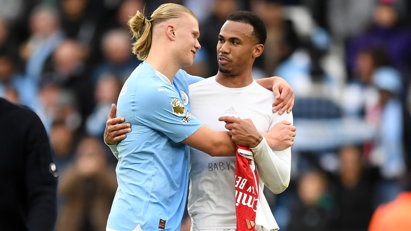 Manchester City's Erling Haaland with Gabriel of Arsenal after the final whistle