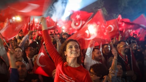 Supporters celebrate as Ekrem İmamoğlu speaks after his re-election in Istanbul, Turkey