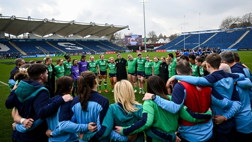 Ireland players huddle after the match