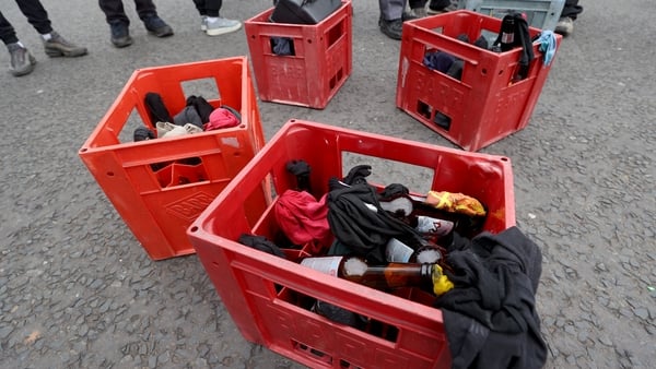 Crates of petrol bombs that are being carried by youths at the start of an Easter Monday parade