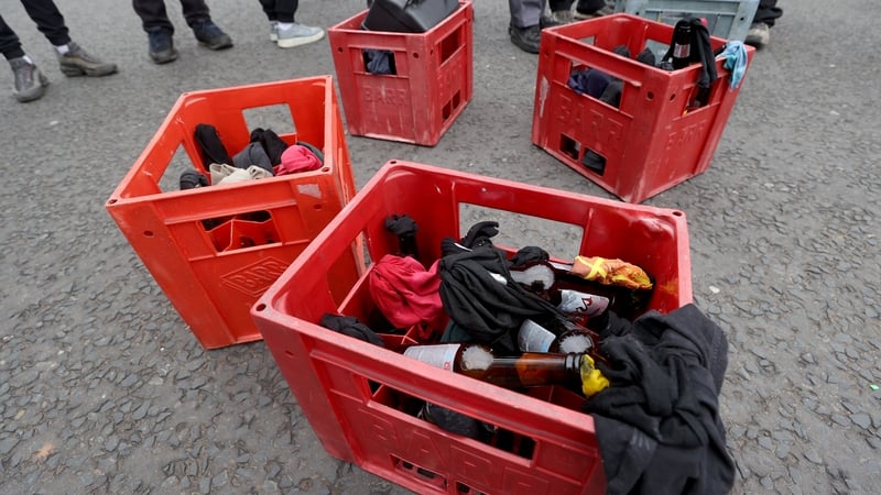 Crates of petrol bombs that are being carried by youths at the start of an Easter Monday parade