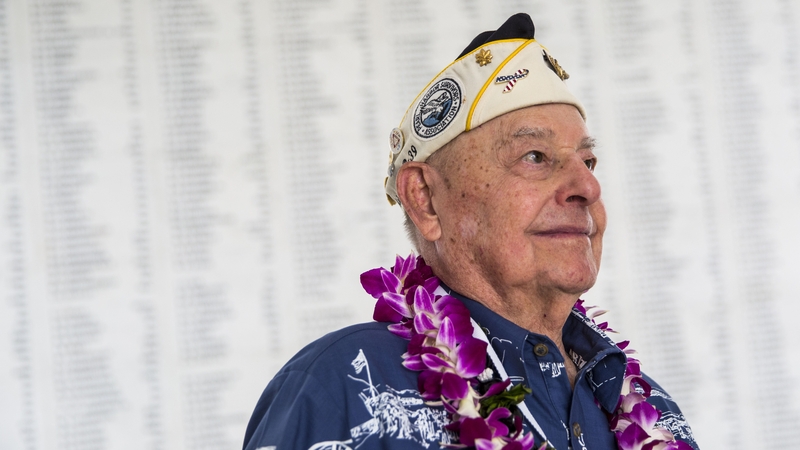Lou Conter looks on near the USS Arizona Remembrance Wall during a 2015 memorial service marking the attack