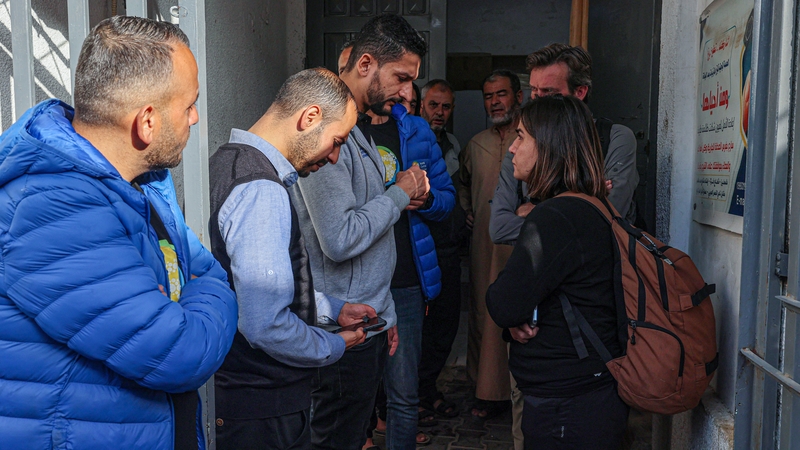 World Central Kitchen staff members wait at a hospital morgue in Rafah after a convoy of the NGO was hit in an Israeli strike