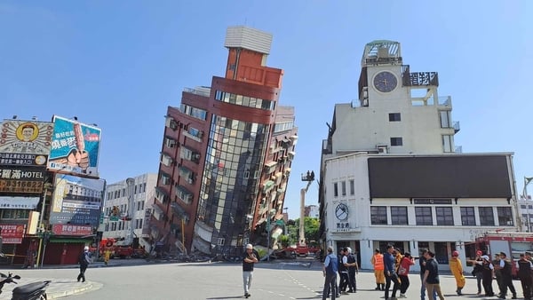 A red building is partially collapsed after a powerful 7.3-magnitude earthquake rocked the entire island