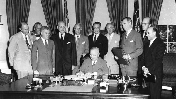 President Harry S. Truman (1884 - 1972) signing a proclamation bringing into effect the North Atlantic Treaty, which marked the beginning of NATO. Photo: Getty Images
