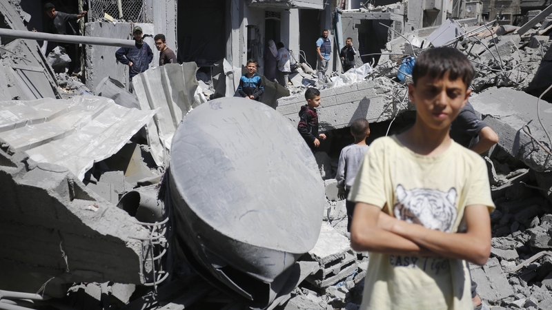 Gazans living in al-Maghazi Refugee Camp scouring the rubble for salvage following an Israeli attack on Deir al-Balah on 4 April