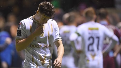 Shelbourne's Matty Smith reacts to a break in play being called after a flare is thrown at a linesman