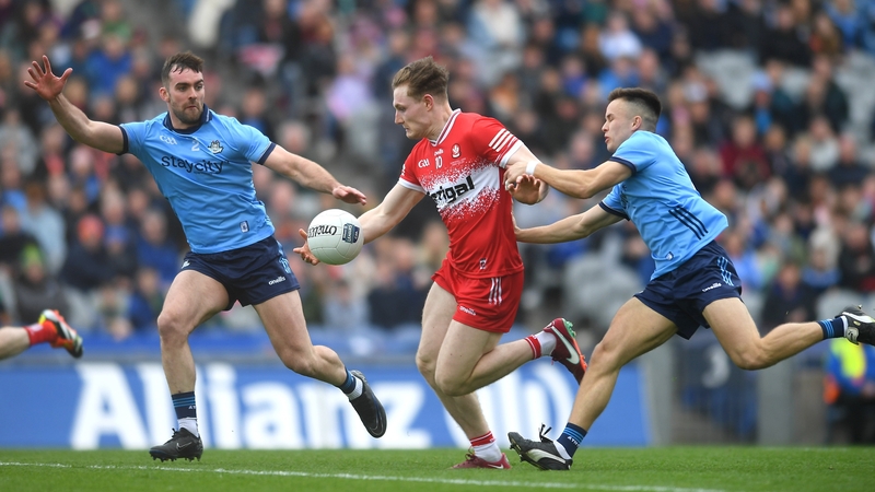 Ethan Doherty of Derry in action against Dublin players, Eoin Murchan right, and Seán MacMahon during last weekend's final