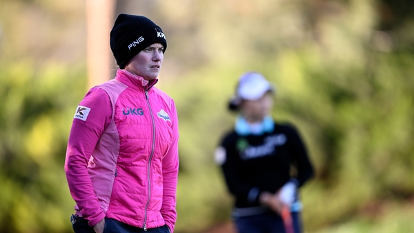 Leona Maguire watches a Moriya Jutanugarn shot on the third hole