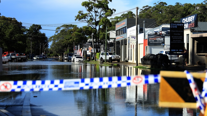 A road in a suburb of Sydney is pictured flooded after heavy rainfall caused the New South Wales government to declare a natural disaster
