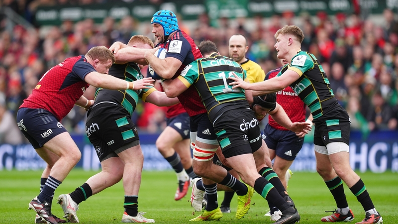 Munster's Tadhg Beirne (centre) is tackled by Northampton Saints' Burger Odendaal